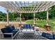 Covered patio area with comfortable seating, ideal for outdoor relaxation and entertaining at 8433 Cheverny Dr, Waxhaw, NC 28173