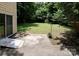 Spacious backyard with patio area, mature trees, a storage shed, and well-maintained lawn at 8618 Rittenhouse Cir, Charlotte, NC 28270