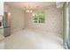 This dining room features a stainless steel refrigerator and a view of outside at 8618 Rittenhouse Cir, Charlotte, NC 28270