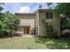 Two-story home with a red front door, siding, and lush landscaping in a green yard at 8618 Rittenhouse Cir, Charlotte, NC 28270