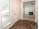 Welcoming entry featuring unique tiled flooring, an adjacent living space, and a bright window at 8618 Rittenhouse Cir, Charlotte, NC 28270