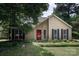 Charming single-Gathering home featuring a red front door, black shutters, and well-maintained landscaping at 8618 Rittenhouse Cir, Charlotte, NC 28270