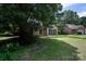 Beautiful house with lush greenery, a red front door, and a serene neighborhood setting at 8618 Rittenhouse Cir, Charlotte, NC 28270