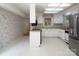 Kitchen featuring white cabinets, modern appliances, and a window for natural light at 8618 Rittenhouse Cir, Charlotte, NC 28270