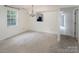 This living room has a large window and is next to the kitchen at 8618 Rittenhouse Cir, Charlotte, NC 28270