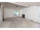 Open living room with neutral walls, large windows, and a cozy fireplace at 8618 Rittenhouse Cir, Charlotte, NC 28270