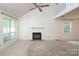 Light-filled living area with a fireplace, vaulted ceilings, and a view to the second floor at 8618 Rittenhouse Cir, Charlotte, NC 28270
