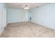 Bright main bedroom with carpet, light-blue walls, ceiling fan, and a window for natural light at 8618 Rittenhouse Cir, Charlotte, NC 28270