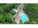 Aerial view of community pools surrounded by lush greenery offering recreational opportunities for residents and their families at 8722 Heron Glen Dr, Charlotte, NC 28269
