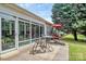 Outdoor back patio provides a relaxing seating area and shaded trees at 8722 Heron Glen Dr, Charlotte, NC 28269