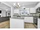 Kitchen area with a view of the living room and stainless appliances at 8722 Heron Glen Dr, Charlotte, NC 28269