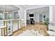 Open concept living space with hardwood floors and a view of the cozy living room with a fireplace at 8722 Heron Glen Dr, Charlotte, NC 28269