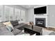 Comfortable living room with shutters, a fireplace, and hardwood floors at 8722 Heron Glen Dr, Charlotte, NC 28269