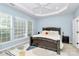 Serene main bedroom with large windows, a ceiling fan, and a comfortable bed with stylish bedding at 8722 Heron Glen Dr, Charlotte, NC 28269
