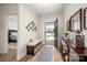 Inviting foyer with bench, console table, and an open view of the home's interior at 1006 Gradison Dr, Matthews, NC 28104