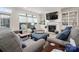 Cozy living room with fireplace, built-in shelves, and comfortable seating area at 1006 Gradison Dr, Matthews, NC 28104