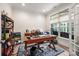 Bright home office featuring hardwood floors, a large window, and stylish furnishings for a productive workspace at 1006 Gradison Dr, Matthews, NC 28104