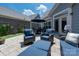 Cozy patio features outdoor seating, an outdoor table and a plush lounge area great for backyard entertaining at 1006 Gradison Dr, Matthews, NC 28104
