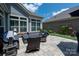 Outdoor patio featuring comfortable wicker seating with blue cushions and coordinated decor against a backdrop of the home's exterior at 1006 Gradison Dr, Matthews, NC 28104