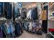 Walk-in closet with ample hanging space and shelving for organized storage of clothes and accessories at 1006 Gradison Dr, Matthews, NC 28104