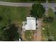 Bird's eye view displays the property with well-maintained yard, a covered patio, and a nearby paved road at 1028 Washburn Switch Rd, Shelby, NC 28150