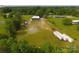 Expansive aerial view showcases property and surrounding greenery with road access and ample parking space at 1028 Washburn Switch Rd, Shelby, NC 28150
