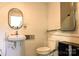 Cozy bathroom featuring a toilet, sink, medicine cabinet, and storage space at 1028 Washburn Switch Rd, Shelby, NC 28150