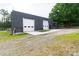 Exterior showcasing a sleek gray building with two large garage doors at 1028 Washburn Switch Rd, Shelby, NC 28150