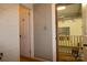 Hallway with multiple doors featuring wood flooring, neutral walls, and overhead lighting at 1028 Washburn Switch Rd, Shelby, NC 28150