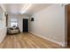 Spacious open room with bright lighting, wood flooring, and neutral walls at 1028 Washburn Switch Rd, Shelby, NC 28150