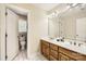 Full bathroom with double sink vanity, large mirror, and seperate toilet room at 1185 Willow Creek Dr, Newton, NC 28658
