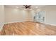 Spacious bedroom with hardwood floors, ceiling fan, and double doors leading to a private outdoor space at 1185 Willow Creek Dr, Newton, NC 28658