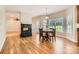 Inviting dining area with fireplace, hardwood floors, and natural light from multiple windows at 1185 Willow Creek Dr, Newton, NC 28658
