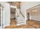 Bright foyer with hardwood floors, staircase, and open view to the dining room, perfect for entertaining guests at 1185 Willow Creek Dr, Newton, NC 28658
