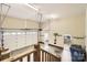Large garage with high ceilings, concrete floor, and door to interior of home at 1185 Willow Creek Dr, Newton, NC 28658