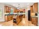 Well-appointed kitchen featuring custom cabinets, granite countertops, and a functional island, great for cooking at 1185 Willow Creek Dr, Newton, NC 28658