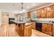 Gourmet kitchen with stone countertops, custom cabinetry, and modern appliances, seamlessly connected to a cozy living area at 1185 Willow Creek Dr, Newton, NC 28658