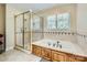 Main bathroom featuring shower with glass door and soaking tub with jets at 1185 Willow Creek Dr, Newton, NC 28658