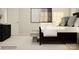 Bedroom featuring a large bed, neutral color palette, and modern decor at 130 Oconee Trl, Statesville, NC 28625