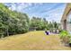 Expansive backyard featuring a lush lawn and mature trees, perfect for outdoor activities and relaxation at 1397 Tupelo Rd, Clover, SC 29710