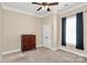 Bedroom with neutral walls, carpet, ceiling fan and a wooden dresser beside the window at 1397 Tupelo Rd, Clover, SC 29710