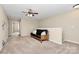 Open concept bonus room featuring carpet, ceiling fan, and a comfortable couch at 1397 Tupelo Rd, Clover, SC 29710