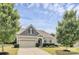 Charming single Gathering home featuring manicured lawn, two-car garage, and craftsman style architecture at 1397 Tupelo Rd, Clover, SC 29710