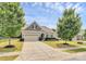 Charming single-Gathering home with a two-car garage, lush lawn, and beautiful landscaping at 1397 Tupelo Rd, Clover, SC 29710