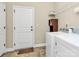 Bright laundry room features tile flooring and a Whirlpool washer and dryer at 1397 Tupelo Rd, Clover, SC 29710