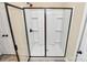 Shower featuring clear glass doors, shelves and shower head at 1397 Tupelo Rd, Clover, SC 29710