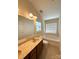 Well-lit bathroom featuring a bathtub, neutral colors and marble countertops at 1423 Napa Nw St, Concord, NC 28027