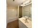 Well-lit bathroom with shower-tub combo and large vanity at 1423 Napa Nw St, Concord, NC 28027
