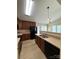 Functional kitchen area with modern appliances, double sink and view into the dining area at 1423 Napa Nw St, Concord, NC 28027