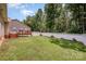 Spacious backyard with white fence and mature trees, perfect for outdoor activities at 146 Pheasant Ridge Cir, York, SC 29745
